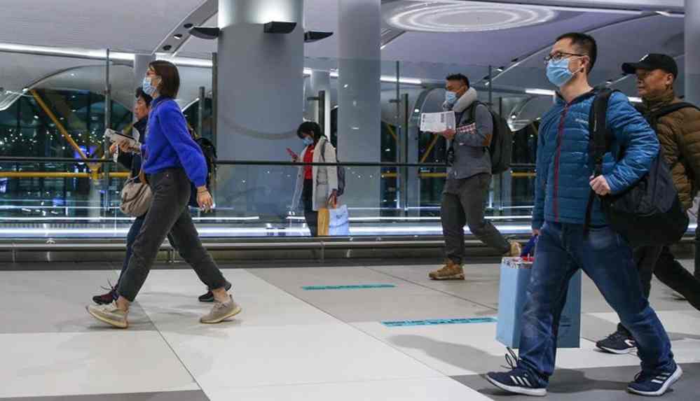 Çin ülke dışından gelenlere de anal Covid-19 testi uygulayacak