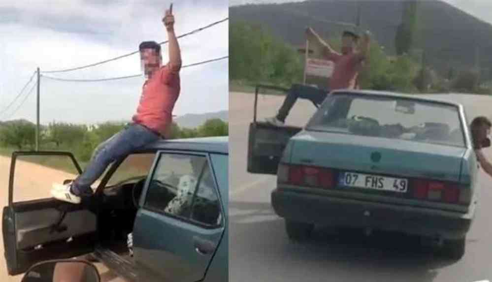 Yok artık! ılgın sürücü trafikte otomobilin önce kapısına çıktı sonra tavanına oturdu...